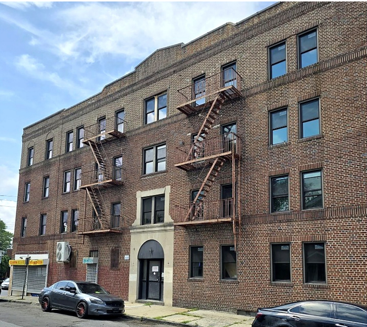 145 West Sidney Avenue, Mount Vernon — full brick building exterior and fire escapes during renovation